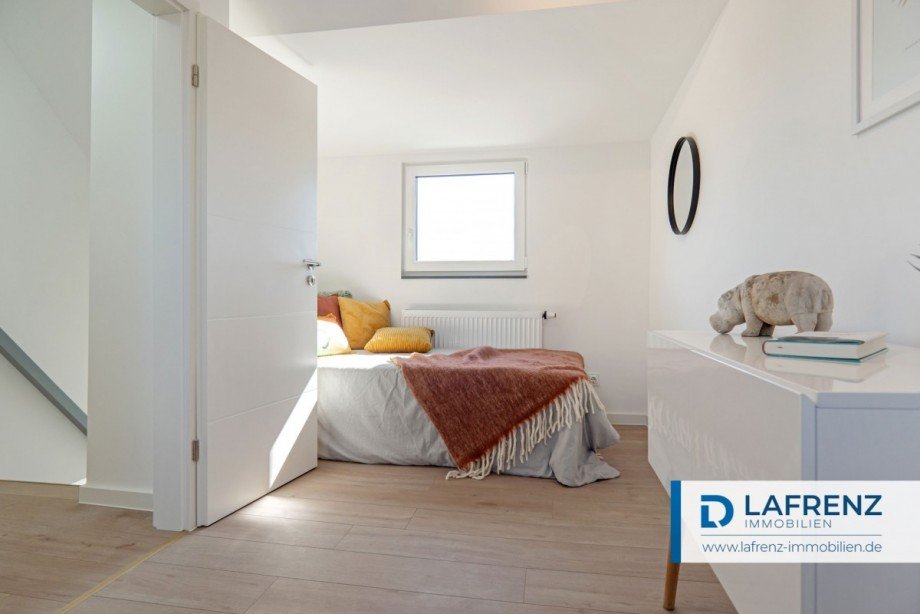 zweites-Schlafzimmer-im-Dachgeschoss Reihenendhaus Fehmarn