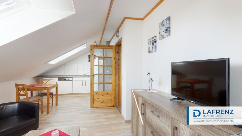 Wohnung im Dachgeschoss Wohnzimmer Ansicht 2 Mehrfamilienhaus Fehmarn
