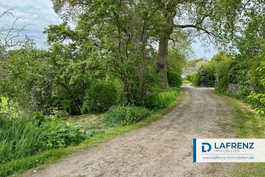 r�ckw�rtige-Zufahrt-�ber-Gemeindeweg Einfamilienhaus Schashagen