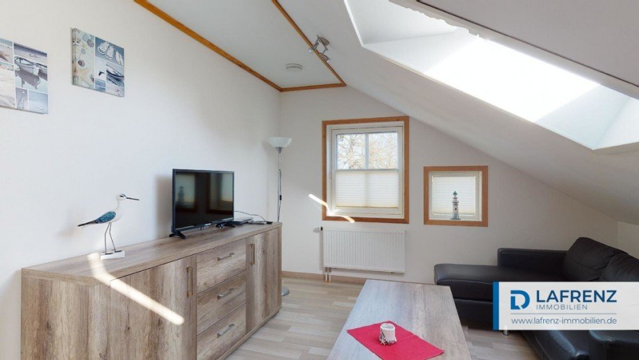 Wohnung im Dachgeschoss Wohnzimmer Mehrfamilienhaus Fehmarn