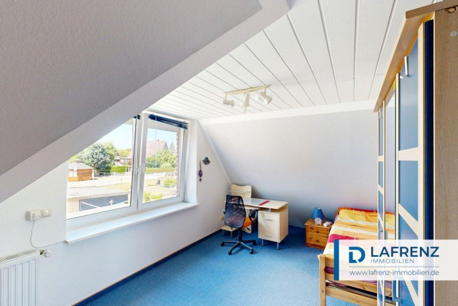 Schlafzimmer-im-Dachgeschoss Zweifamilienhaus Fehmarn