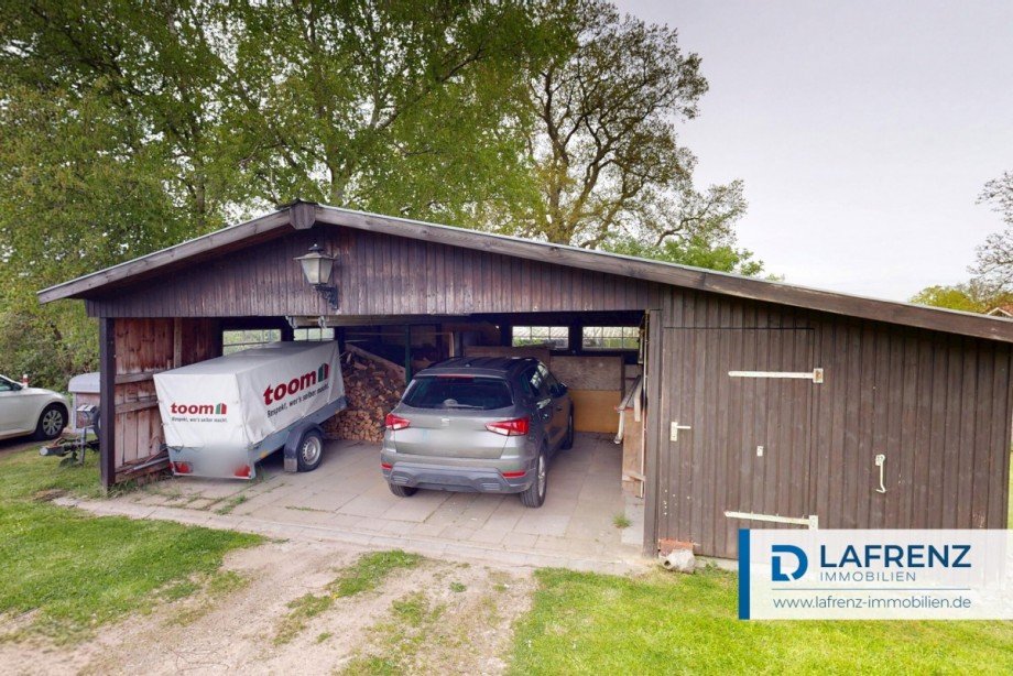 Holzhaus-und-Garage Einfamilienhaus Schashagen